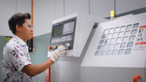 an individual using cnc auto lathe machine
